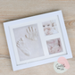 Photo frame with hand and foot imprint